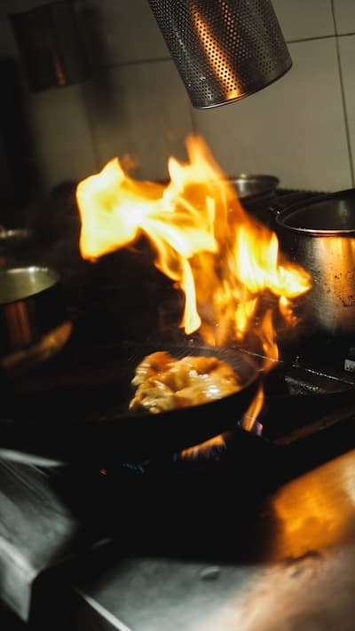 Flames rising from a pan in the kitchen